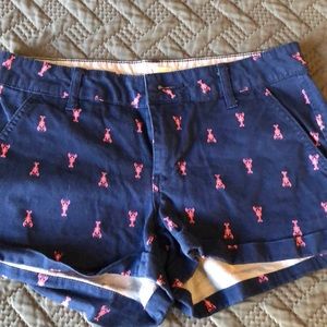 Navy blue shorts with pink lobsters